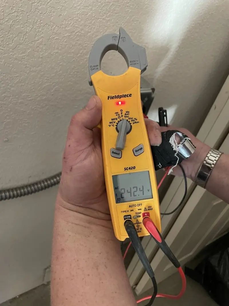 Voltage testing with clamp meter during Circuit Breaker Repair in Lyons